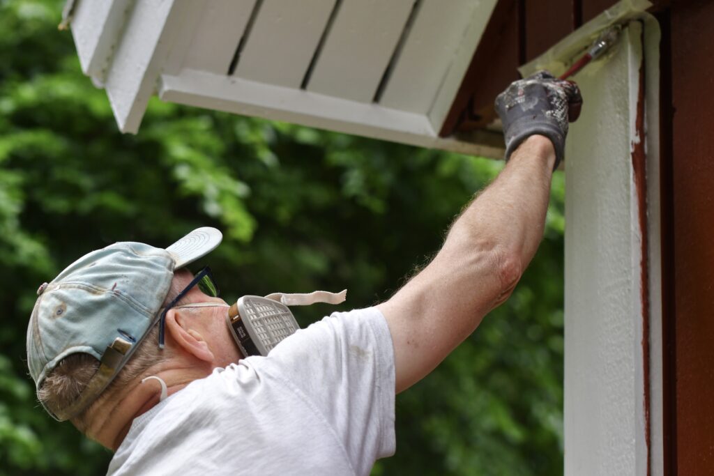 a man painting house exterior with white color 2022 11 11 10 52 52 utc